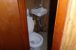Small bathroom with toilet and sink.