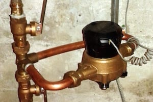 Water meter with copper pipes and fittings.