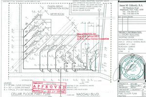 Building floor plan with approval stamps.